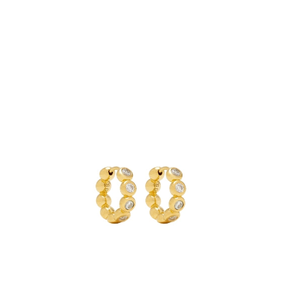 Gold hoop earrings with embedded stones on a white background