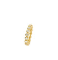 Gold ring with embedded gemstones on a white background
