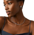 Woman wearing a necklace and earrings on a white background