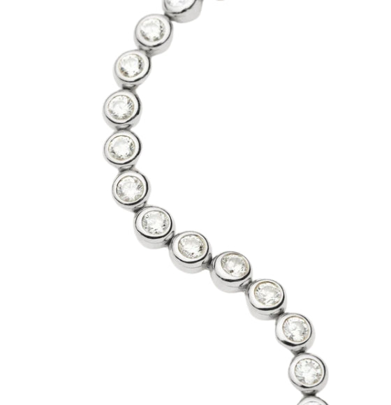 Tennis bracelet with a silver clasp on a white background